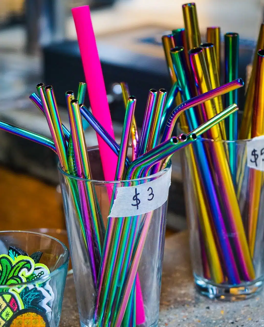 Central Square in Cambridge, MA has some of the best mural arts and local food in the Boston area, including Graffiti Alley! See tips from a tour that focuses on unique small businesses! Pictured: Rainbow metal straws at Abide.
