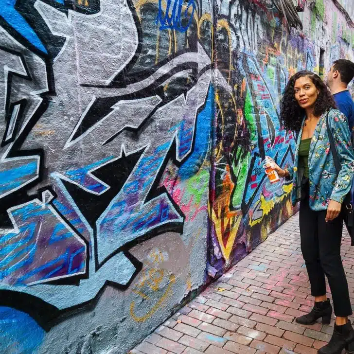 Harmonie getting ready to paint in Graffiti Alley.