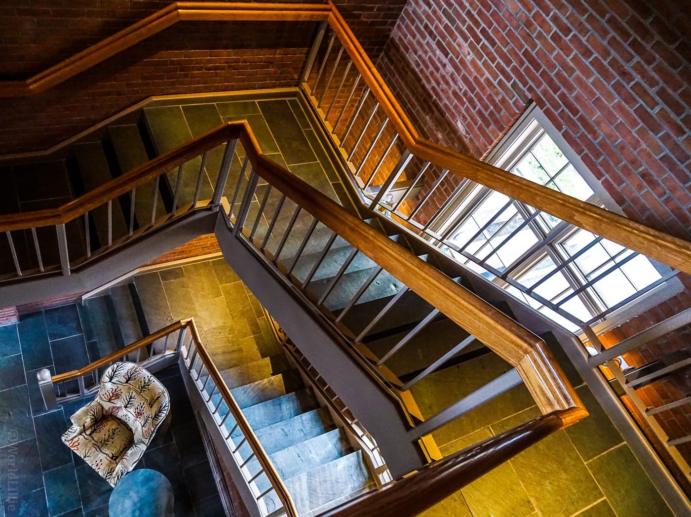 A vertiginous look down a side staircase.