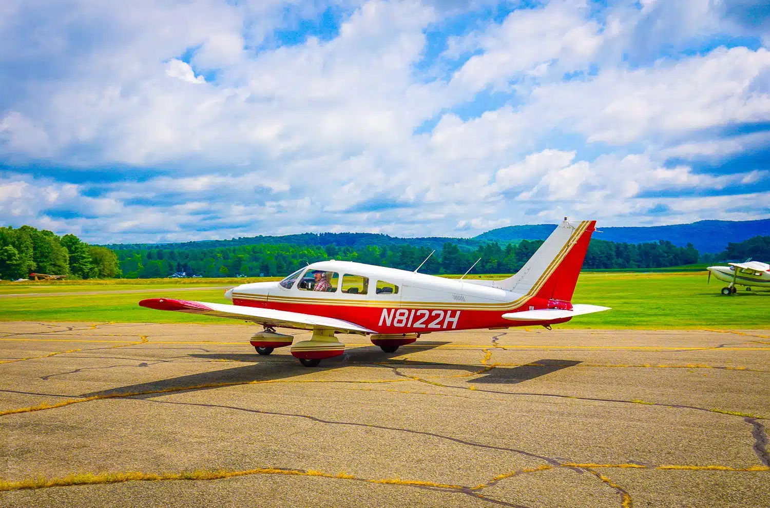 A tiny plane taking off in the Berkshires.