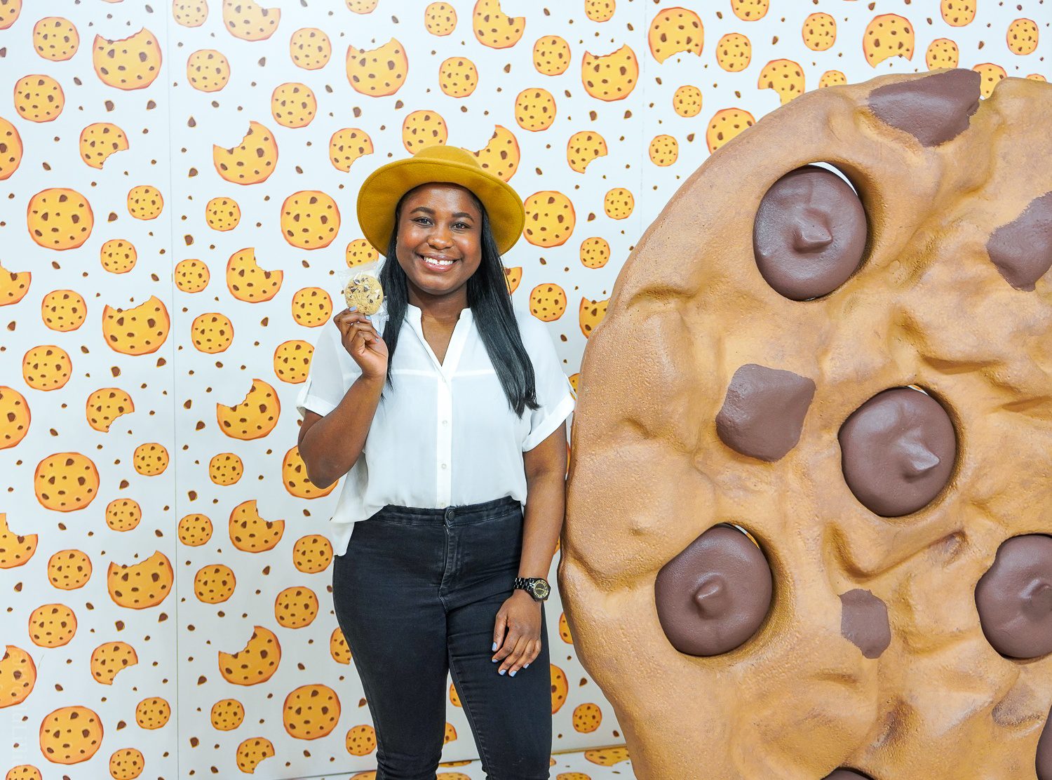 Cookie Room with wallpaper and life sized chocolate chip at Happy Place influencer tour