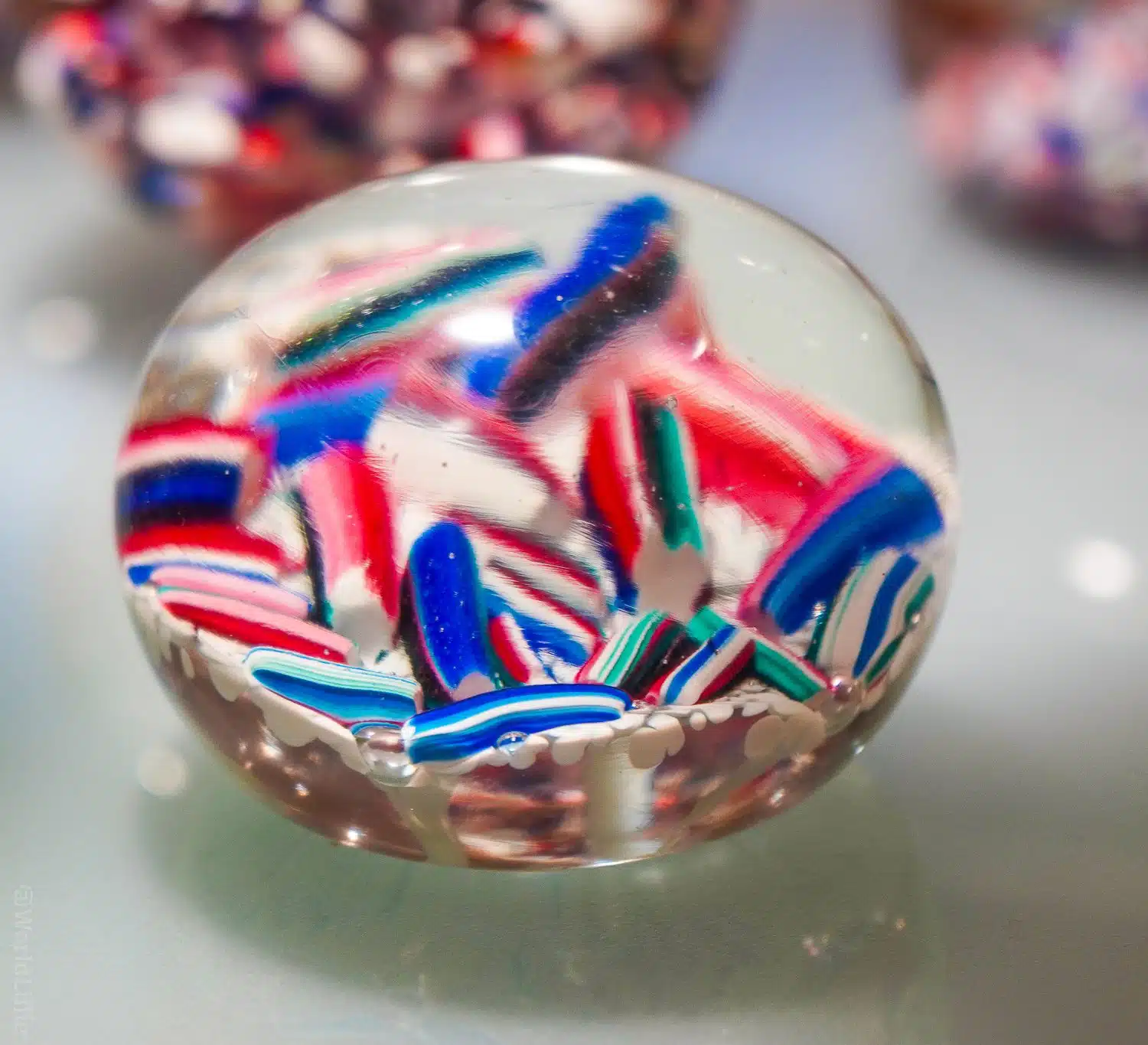 Candy colored glass paperweight