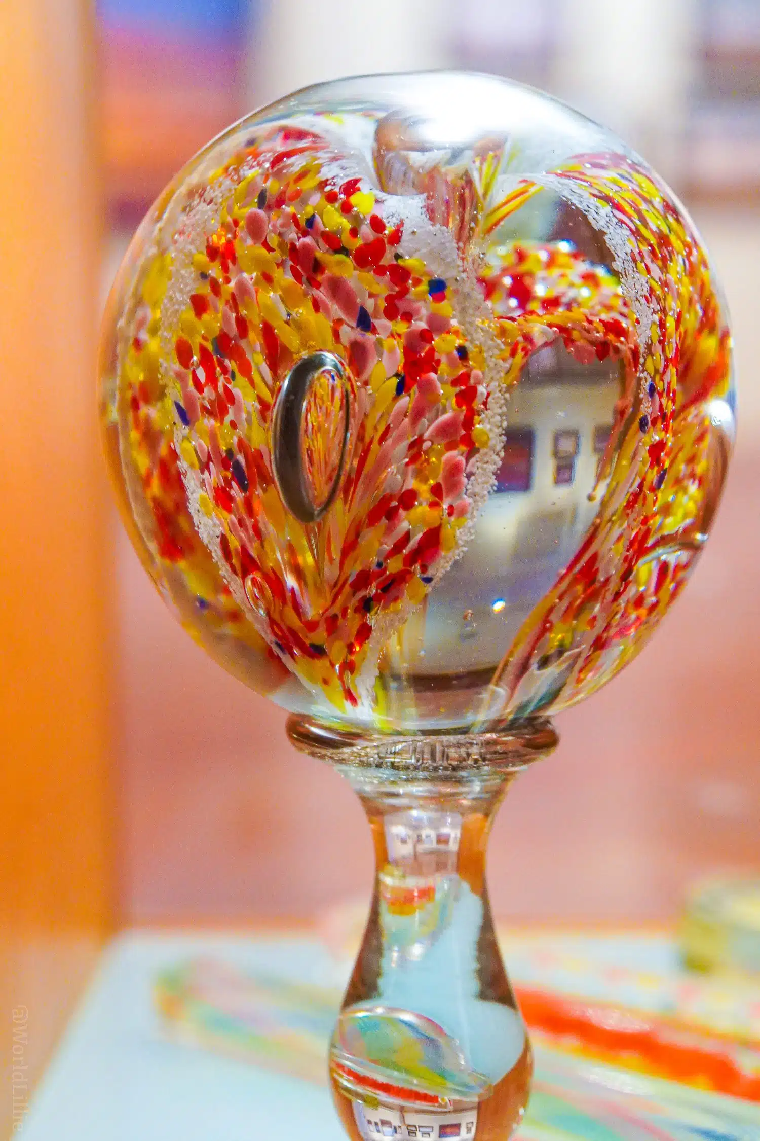 Red and yellow glass paperweight