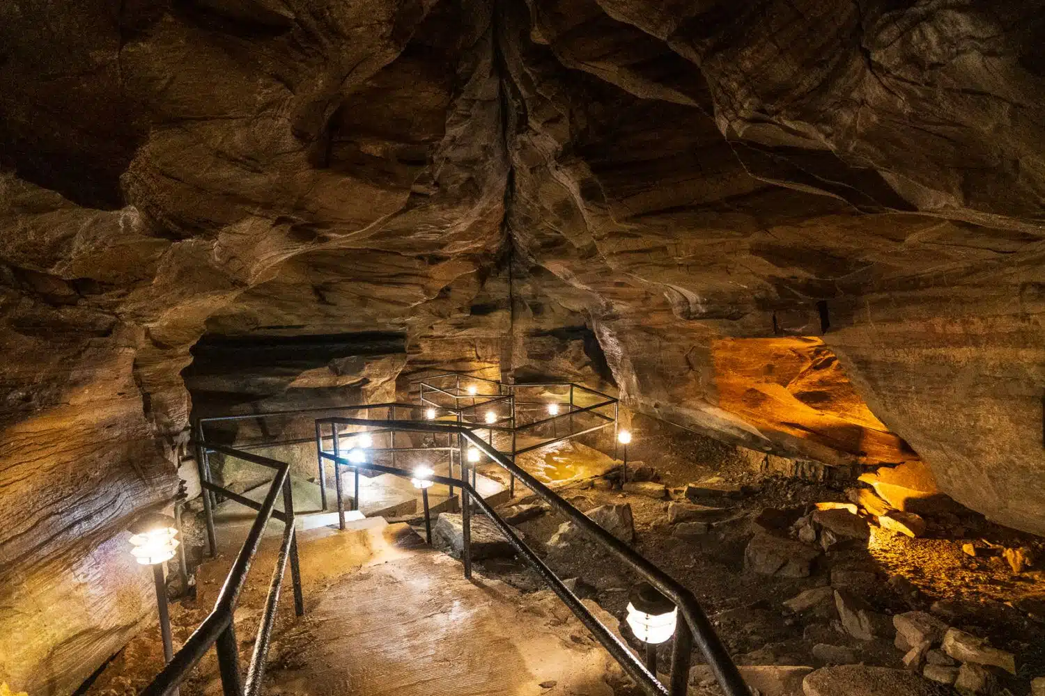 The pathway through the caverns, lit by lights.