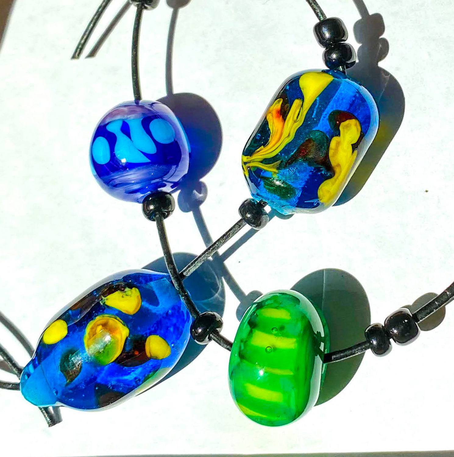 Our glass beads forming a happy stick figure saying thank you!