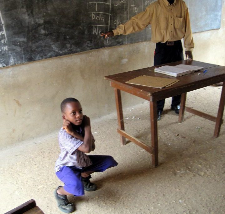 A physical punishment in school in Ghana.