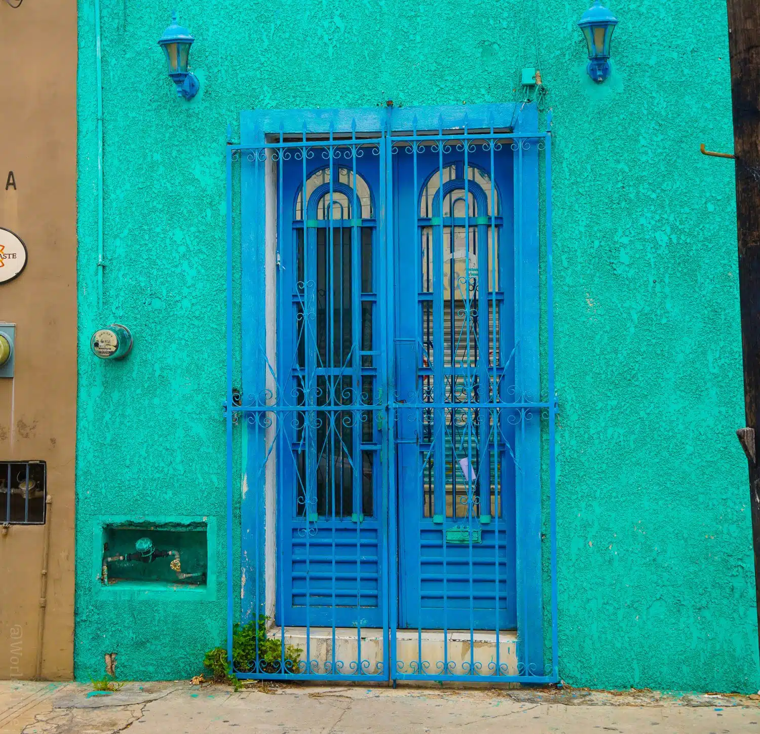What a cheerful blue door and wall!