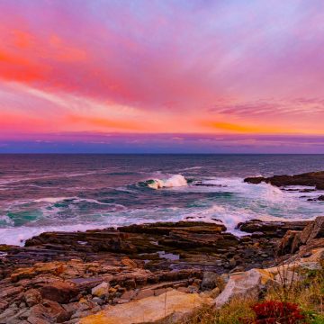 Swooping pink clouds at sunset in Maine.