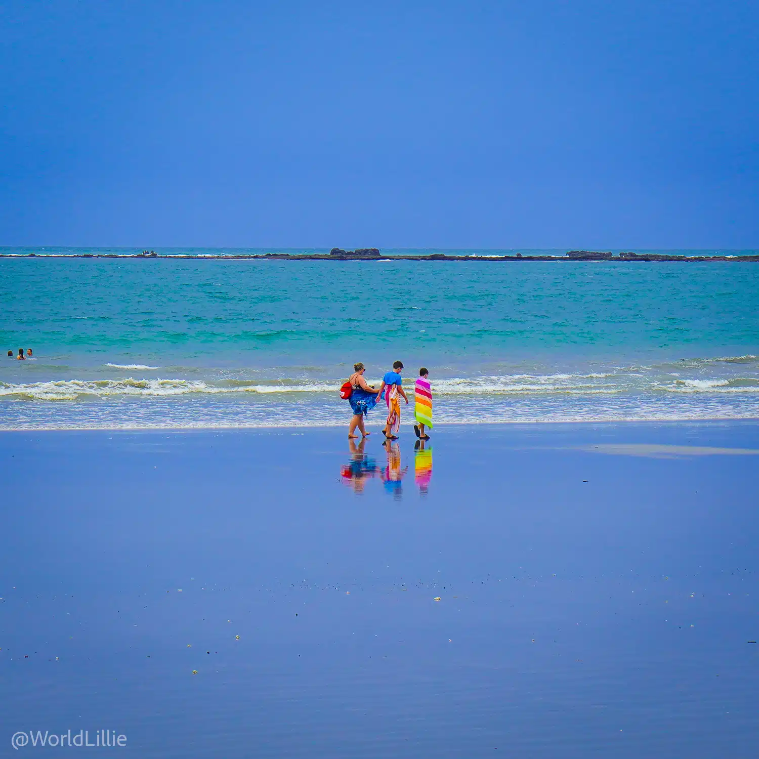 People walking along the beach in Samara near the school.